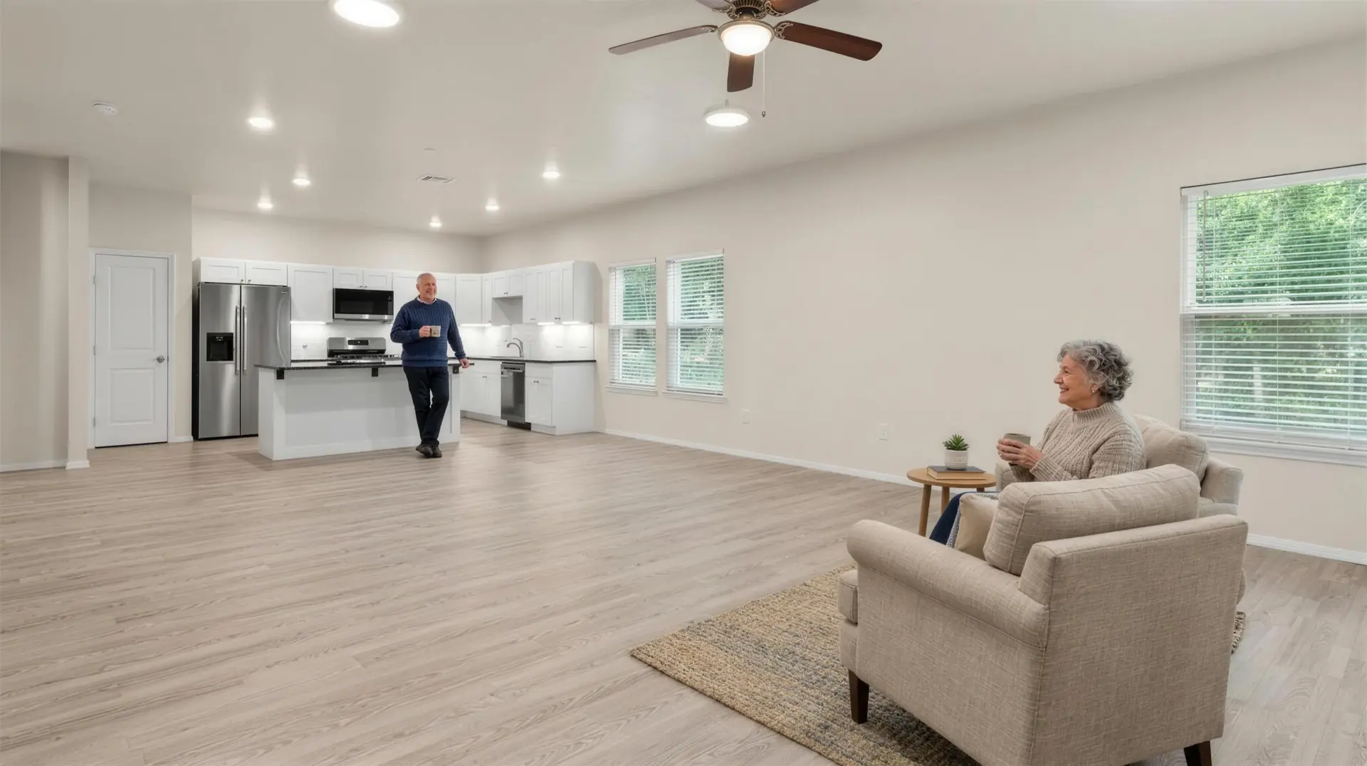 A couple enjoying morning coffee in an open-plan Meadow Hills living room
